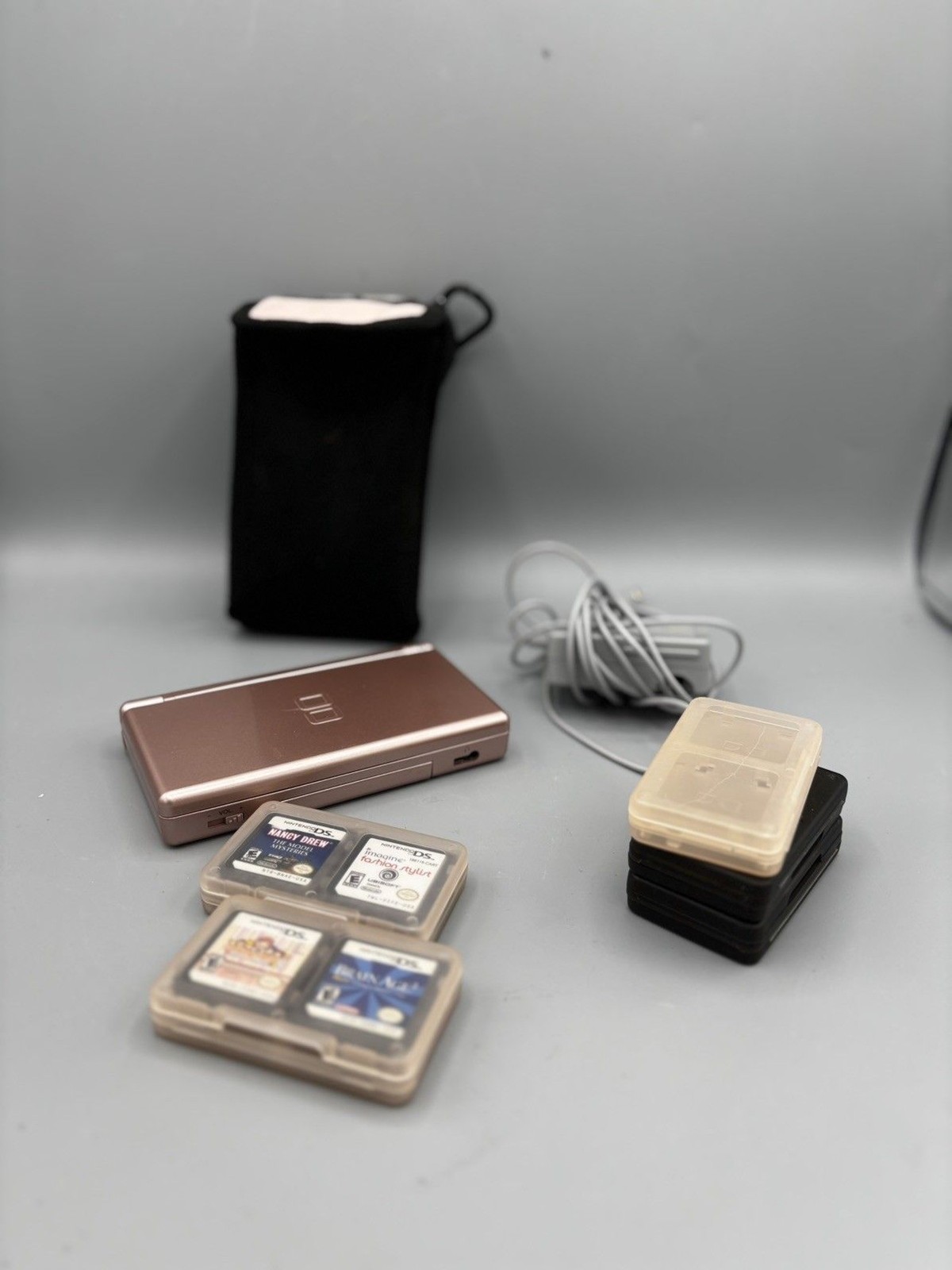 Nintendo DS Lite Metallic Rose Gold with Stylus, Six Games, Charger, Case